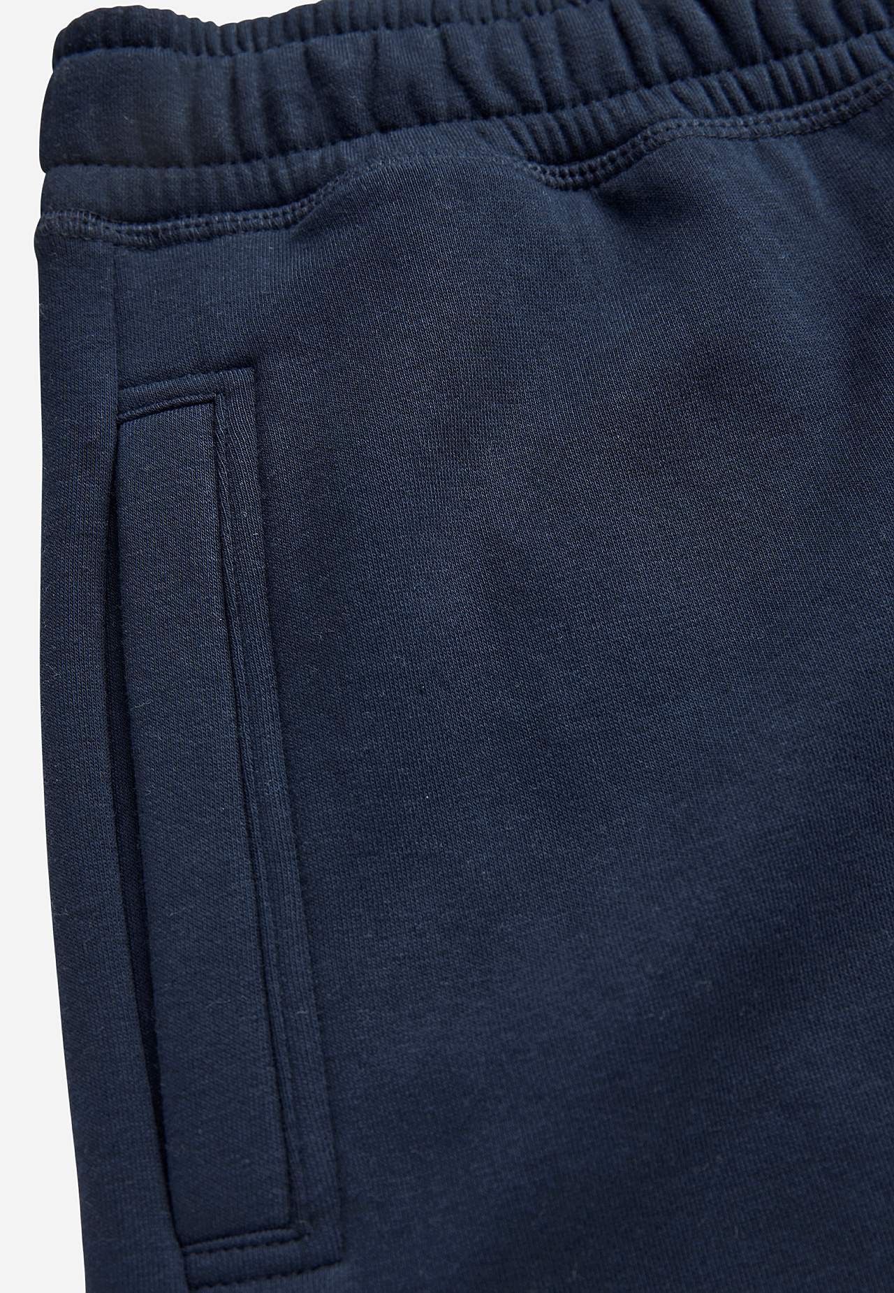 Pohodlné tepláky se zadními kapsami