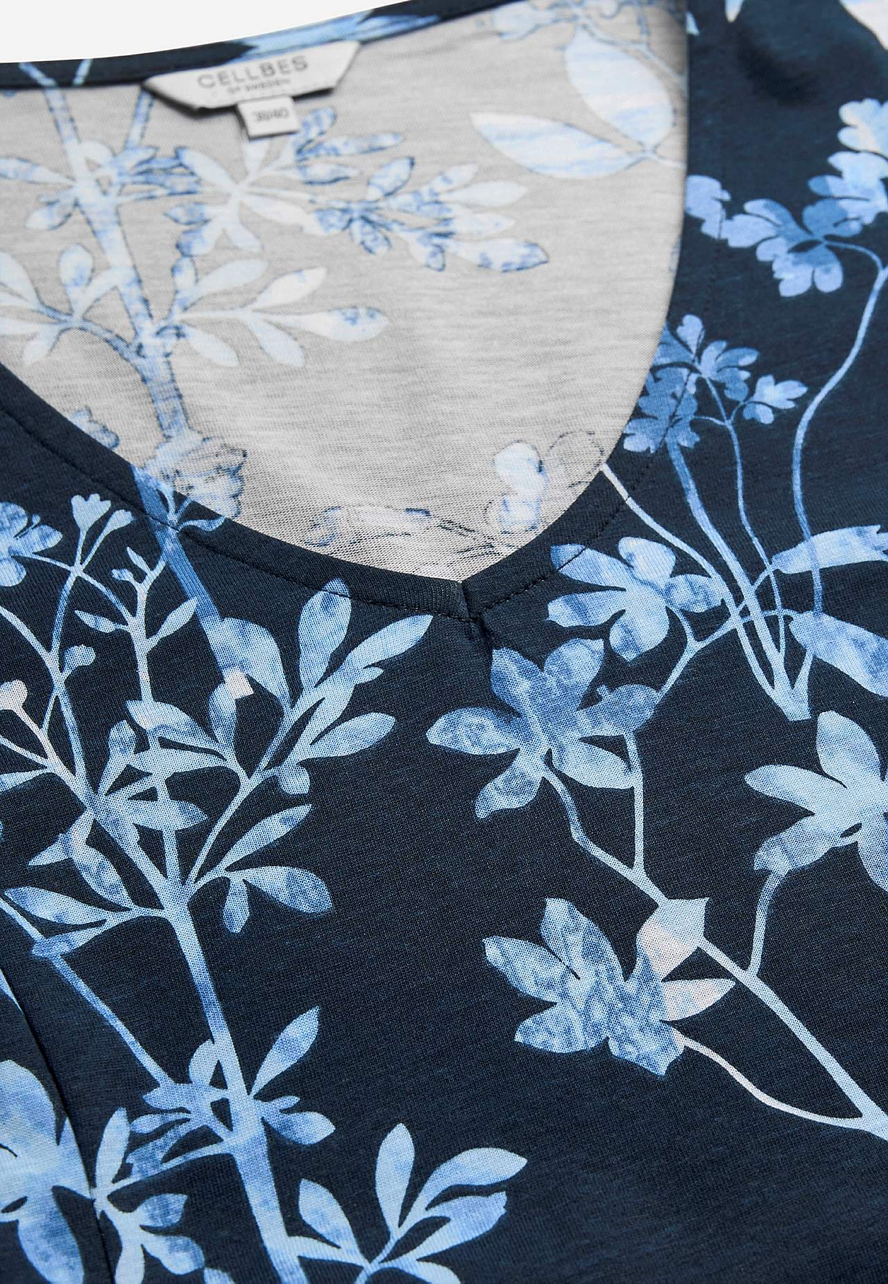 Vzorované žerzejové šaty s kapsami