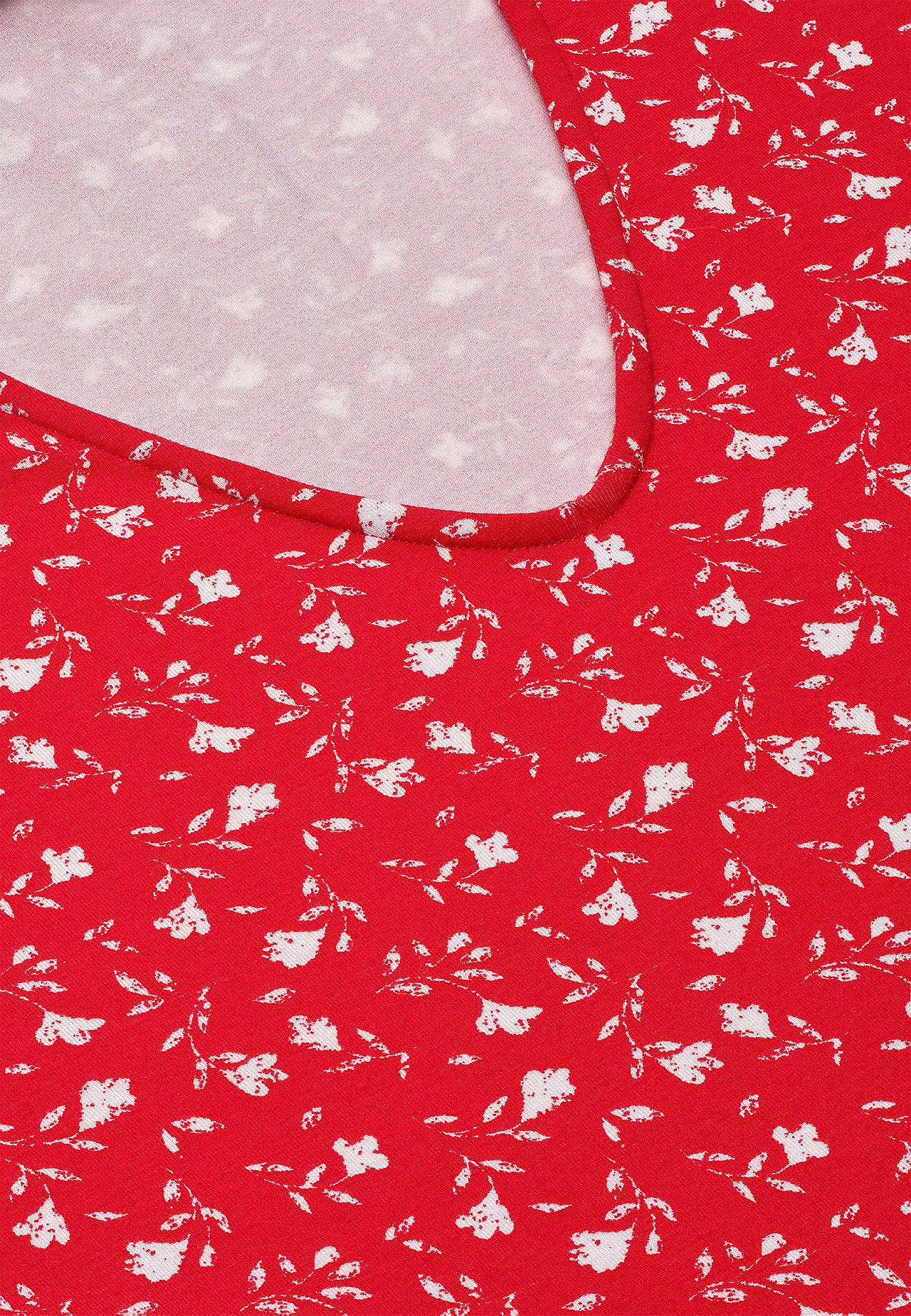 Žerzejové šaty s květinovým vzorem a kapsami