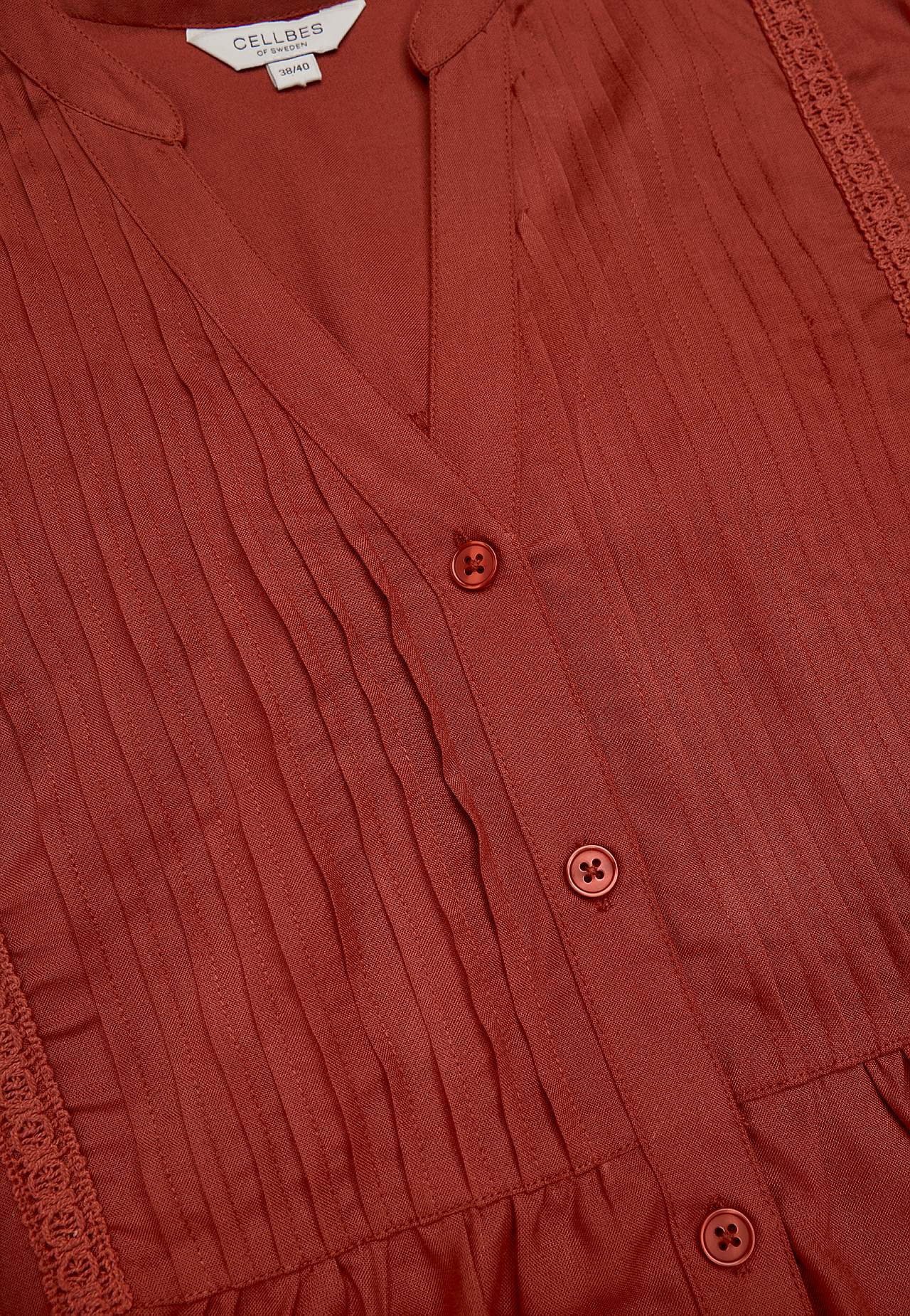 Tkaná tunika s krajkovými olemováními